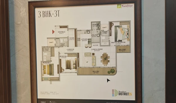 Framed floor plan display for the 3 BHK + 3T unit at Nambiar District 25, showing a sale area of 1536 SFT and carpet area of 1260 SFT