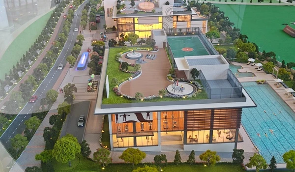 Aerial view of Nambiar District 25 clubhouse highlighting the modern gymnasium, rooftop sports court, and adjacent swimming pool