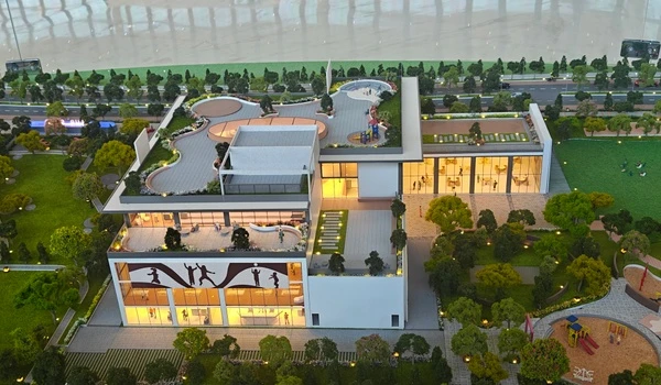Aerial view of Nambiar District 25 clubhouse model highlighting the landscaped rooftop terrace and children's play zone