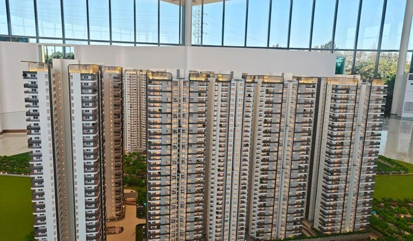 Frontal view of Nambiar District 25 residential blocks showcasing the uniform high-rise architecture and balcony layout