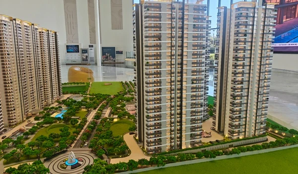 Exterior view of Nambiar District 25 high-rise residential towers featuring modern architecture, balconies, and central landscaped gardens