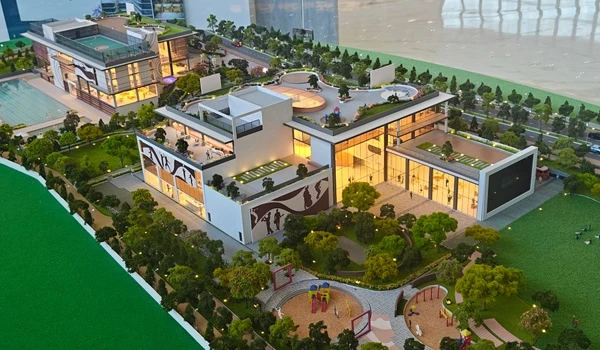 Rooftop amenities at Nambiar District 25 clubhouse featuring a futsal court, amphitheater seating, and terrace garden